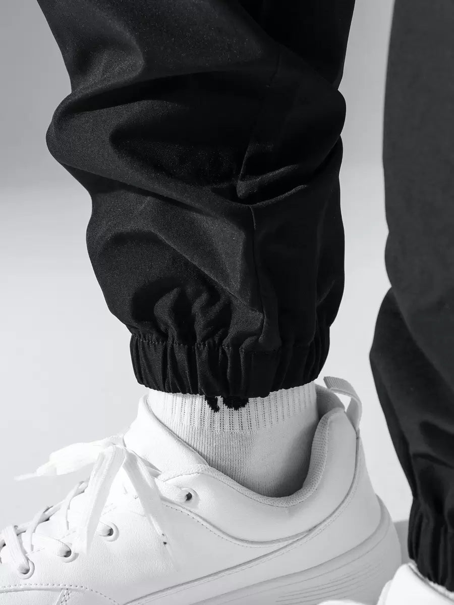 Pantalon cargo ample avec poches à rabat et cordons de serrage pour homme