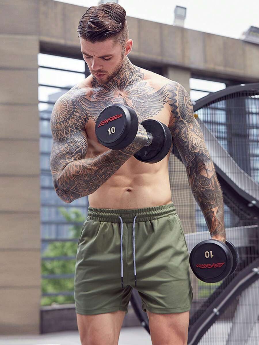 Shorts de sport avec fente, taille élastique et poche pour téléphone pour hommes