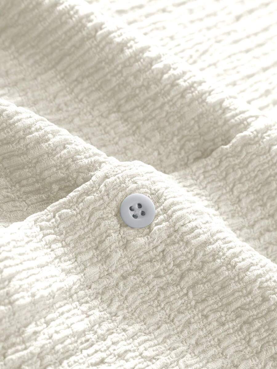 Chemise boutonnée texturée plissée en tricot de style décontracté pour hommes