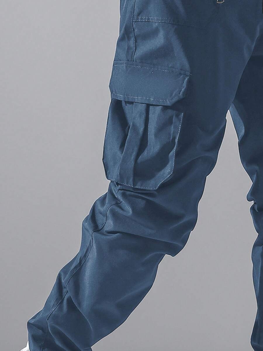 Pantalon cargo ample avec poches à rabat et cordons de serrage pour homme