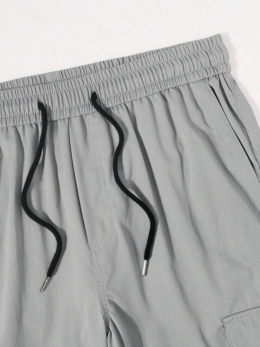 Pantalon cargo ample et décontracté avec cordon de serrage à la taille et poches à rabat