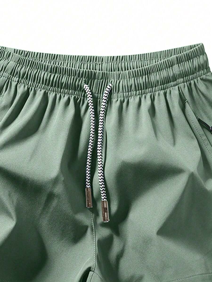 Shorts de sport taille élastique avec poches zippées et cordon