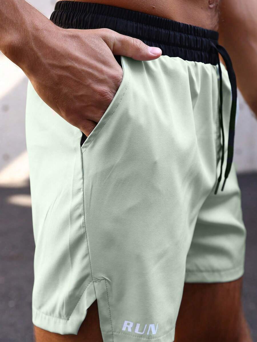 Shorts de sport avec taille élastique, poches larges et inscription