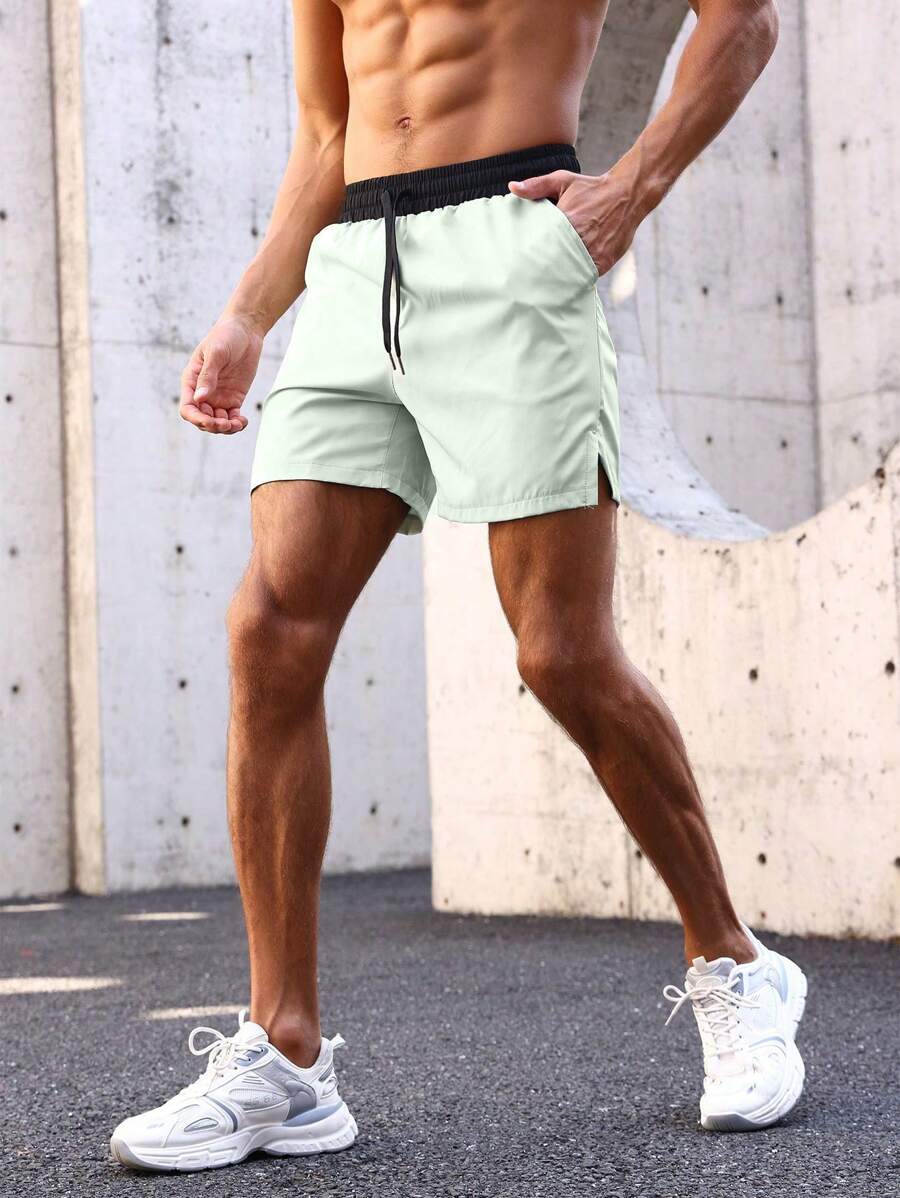 Shorts de sport avec taille élastique, poches larges et inscription