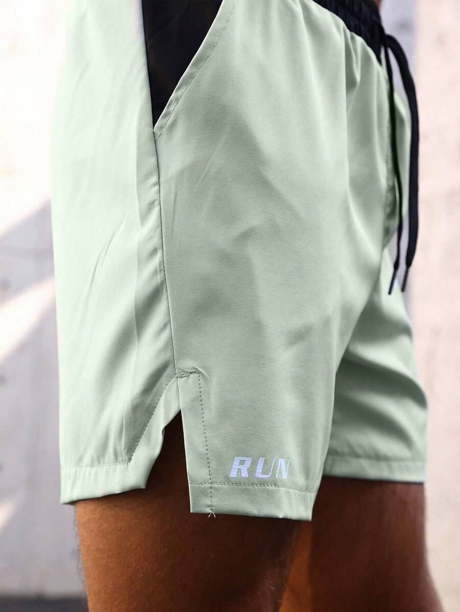 Shorts de sport avec taille élastique, poches larges et inscription
