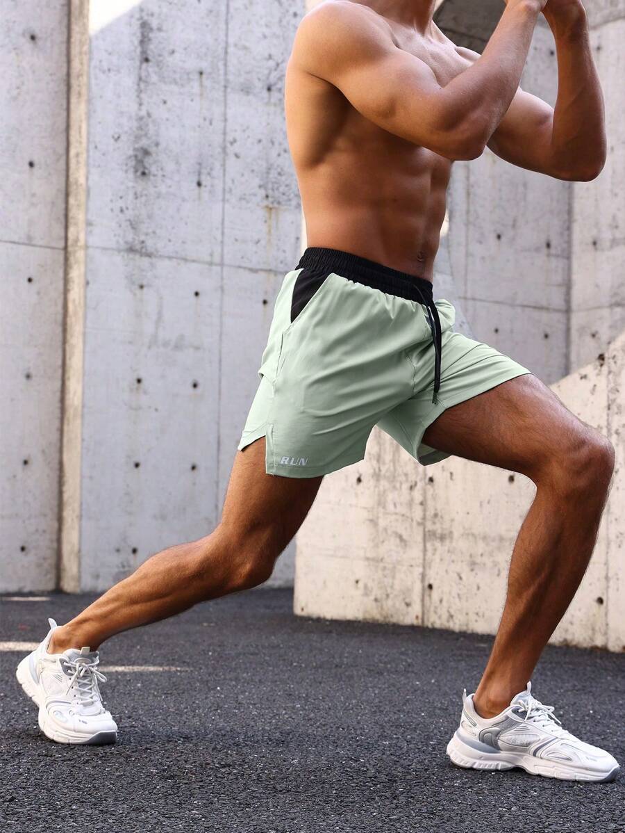 Shorts de sport avec taille élastique, poches larges et inscription