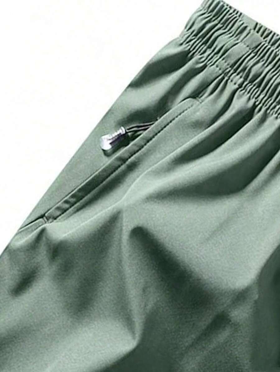 Shorts de sport taille élastique avec poches zippées et cordon
