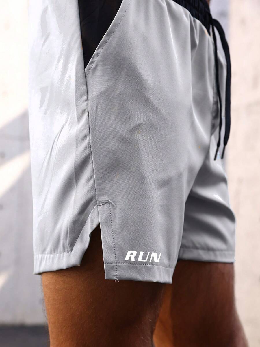 Shorts de sport avec taille élastique, poches larges et inscription