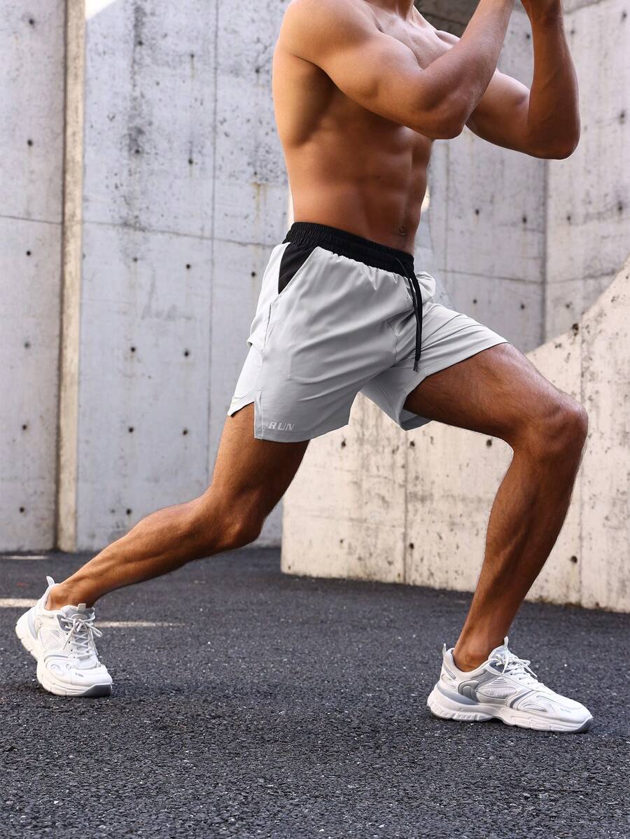 Shorts de sport avec taille élastique, poches larges et inscription