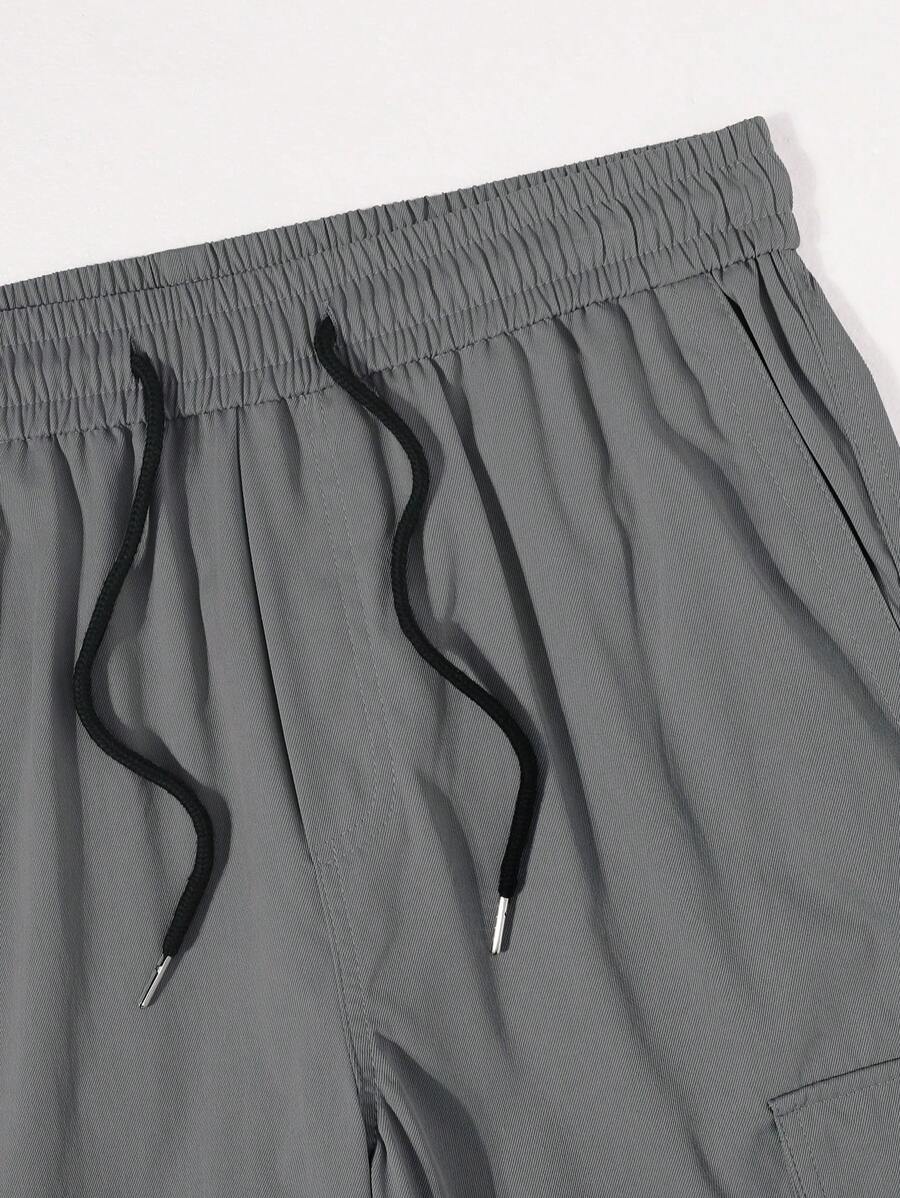 Pantalon cargo ample et décontracté avec cordon de serrage à la taille et poches à rabat
