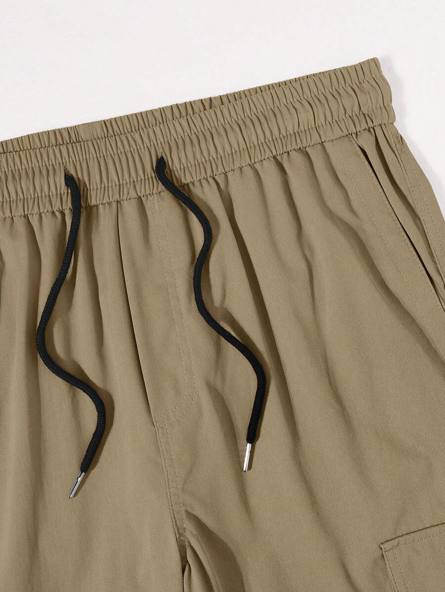 Pantalon cargo ample et décontracté avec cordon de serrage à la taille et poches à rabat