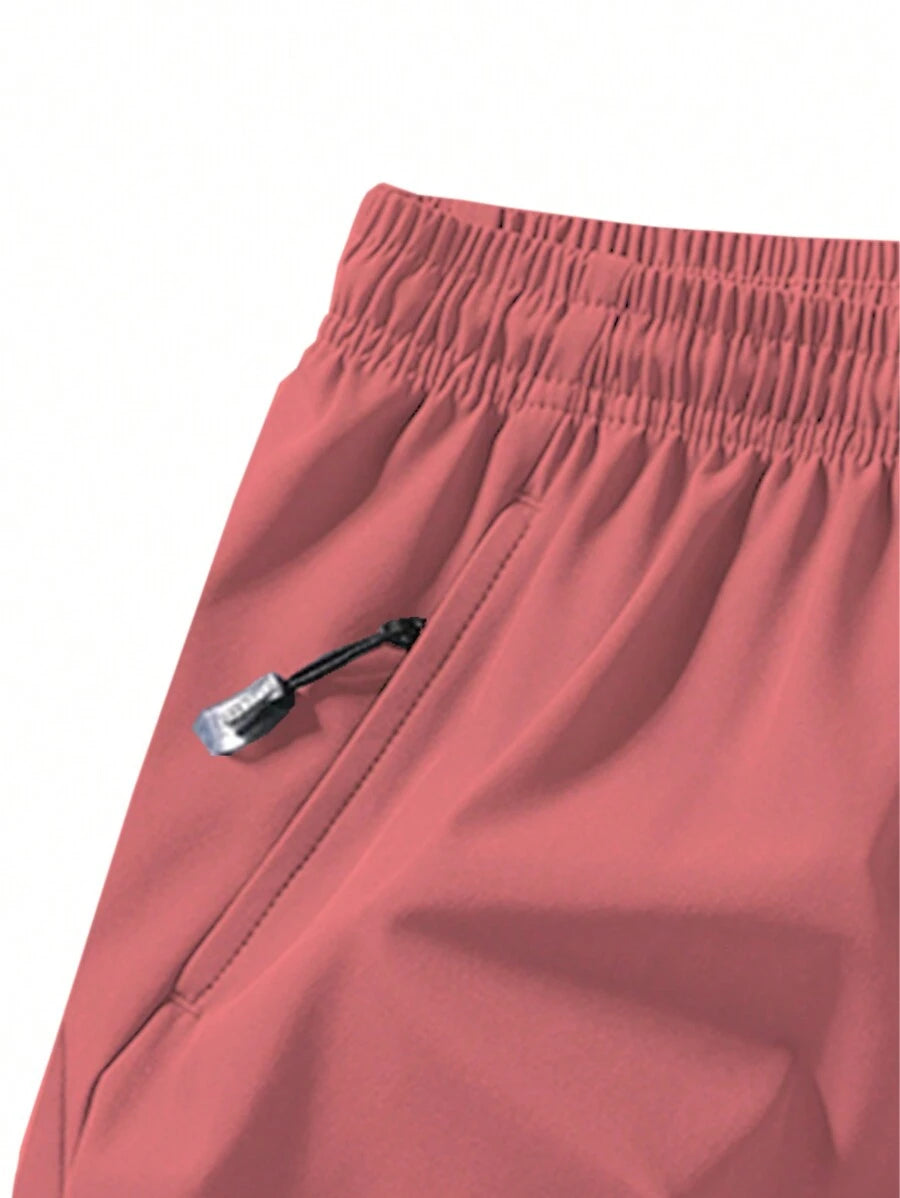 Shorts de sport taille élastique avec poches zippées et cordon