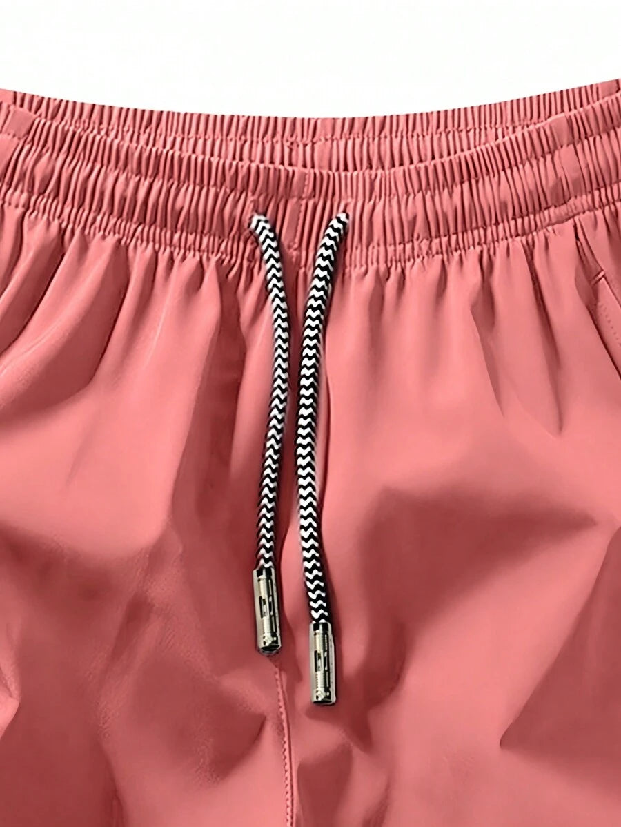 Shorts de sport taille élastique avec poches zippées et cordon