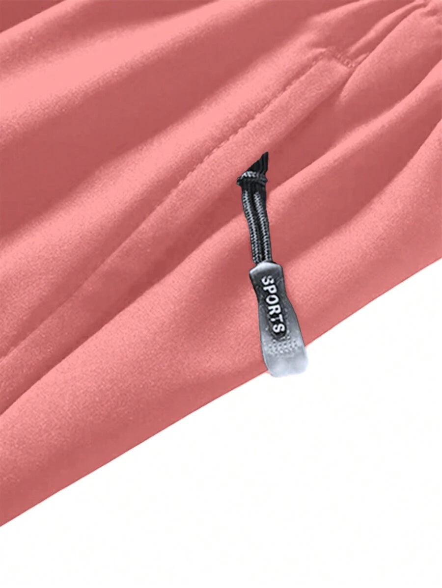 Shorts de sport taille élastique avec poches zippées et cordon