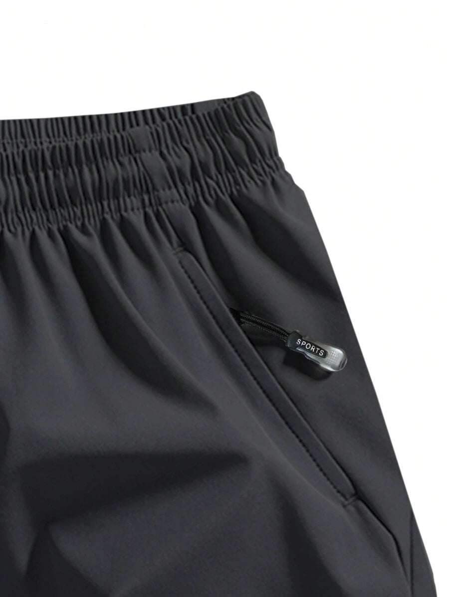 Shorts de sport taille élastique avec poches zippées et cordon
