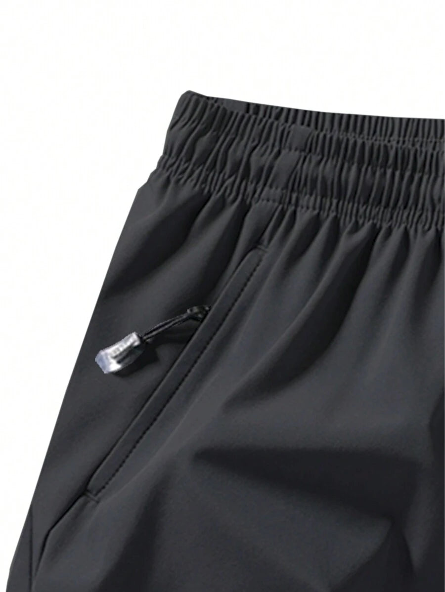 Shorts de sport taille élastique avec poches zippées et cordon