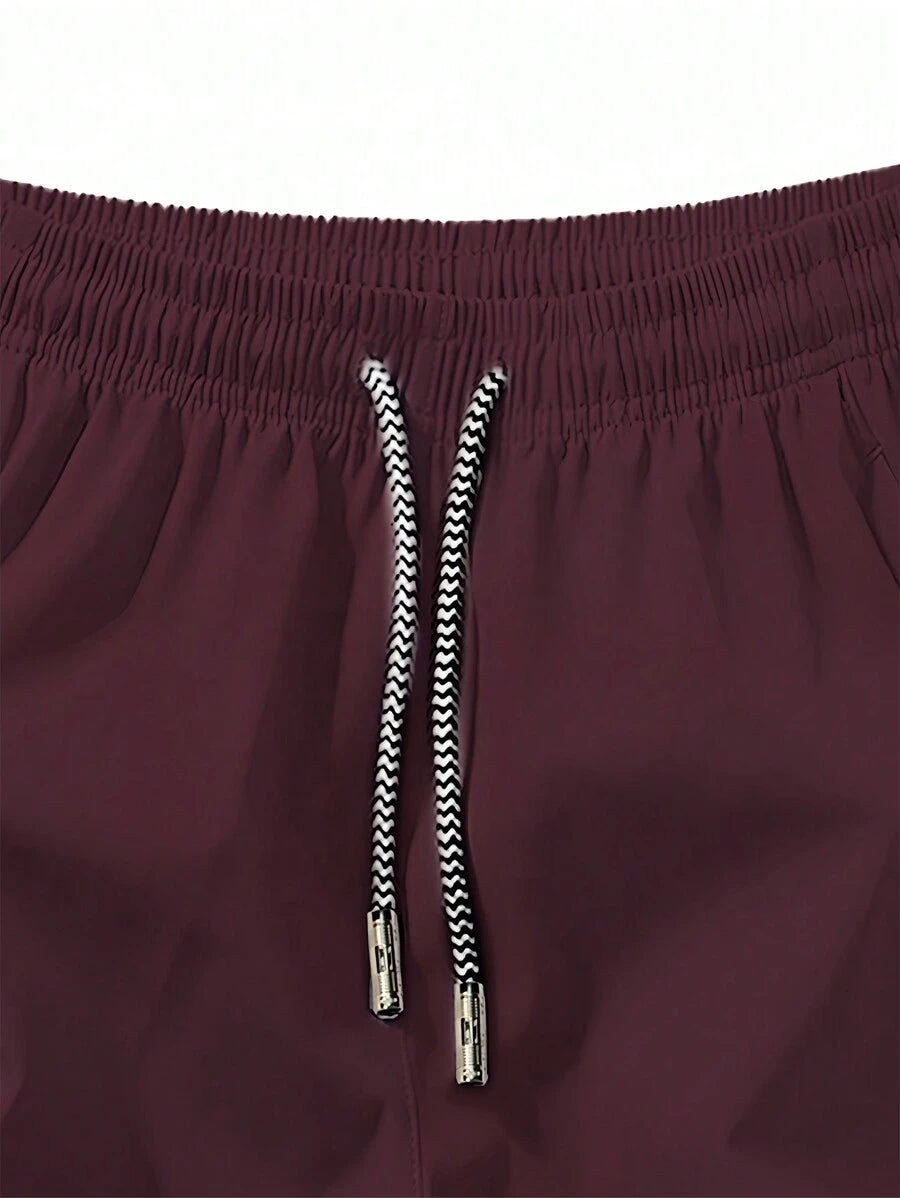 Shorts de sport taille élastique avec poches zippées et cordon