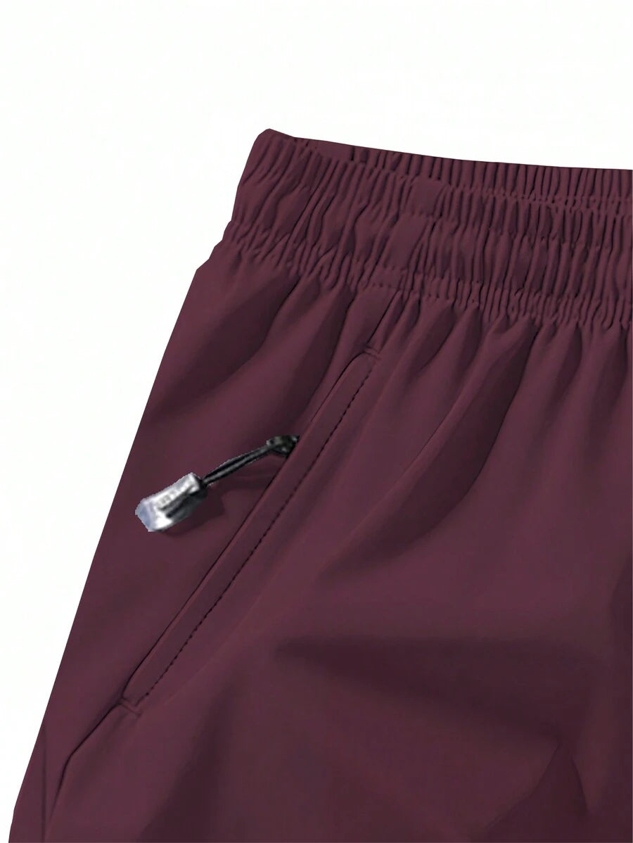 Shorts de sport taille élastique avec poches zippées et cordon