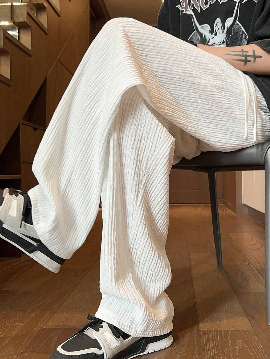 Pantalon droit décontracté en tissu froissé de couleur unie pour homme