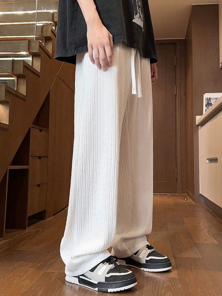 Pantalon droit décontracté en tissu froissé de couleur unie pour homme