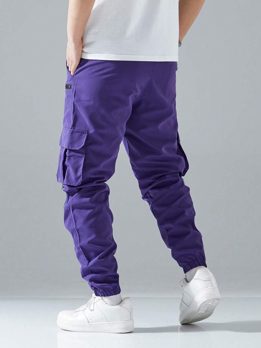 Pantalon cargo ample avec poches à rabat et cordons de serrage pour homme