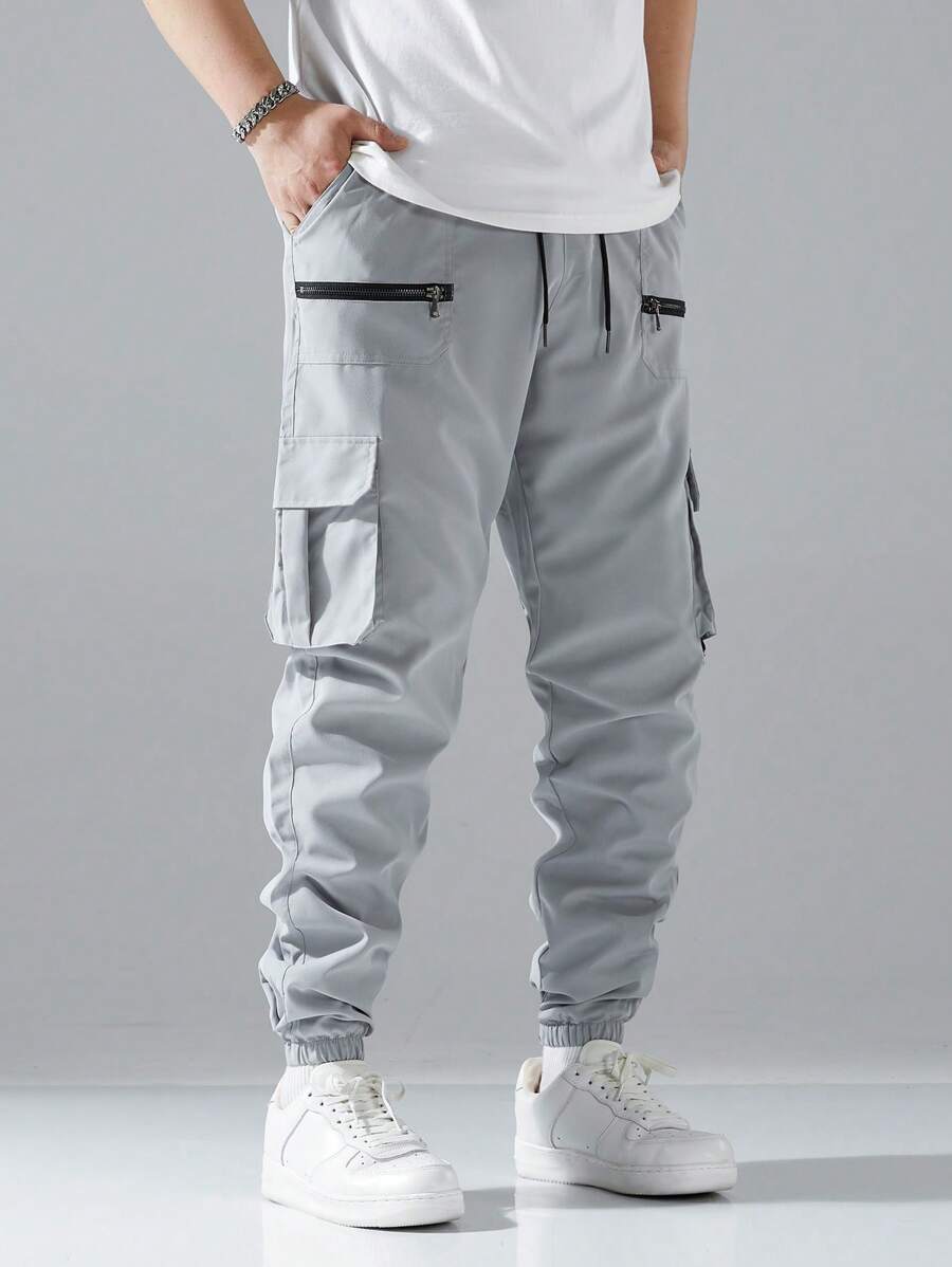 Pantalon cargo ample avec poches à rabat et cordons de serrage pour homme