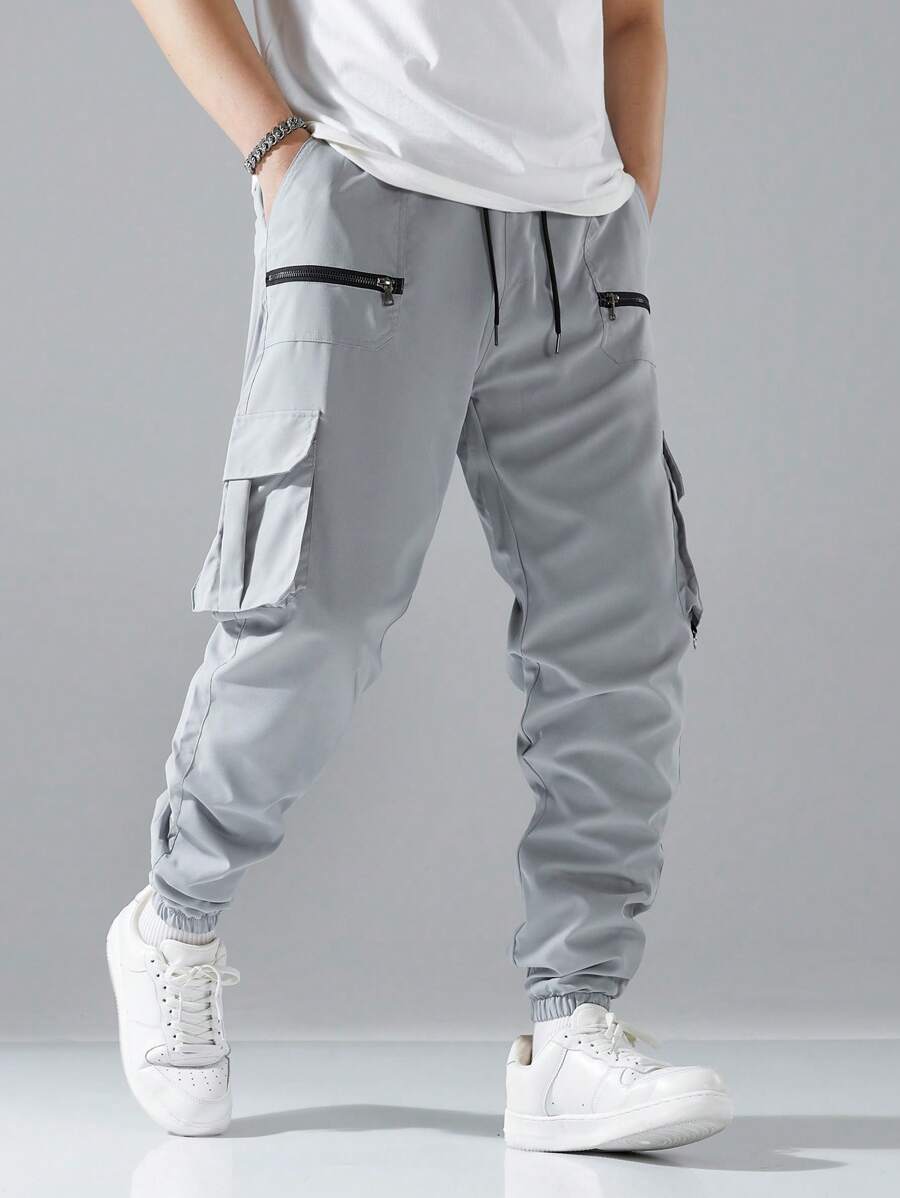 Pantalon cargo ample avec poches à rabat et cordons de serrage pour homme