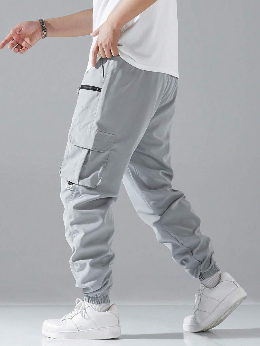 Pantalon cargo ample avec poches à rabat et cordons de serrage pour homme