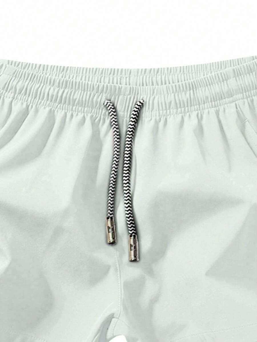 Shorts de sport taille élastique avec poches zippées et cordon
