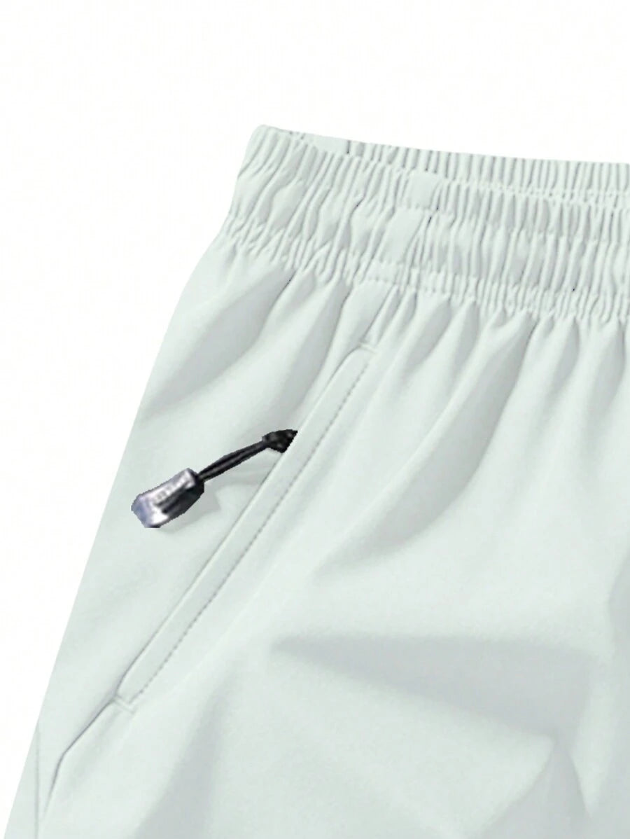 Shorts de sport taille élastique avec poches zippées et cordon