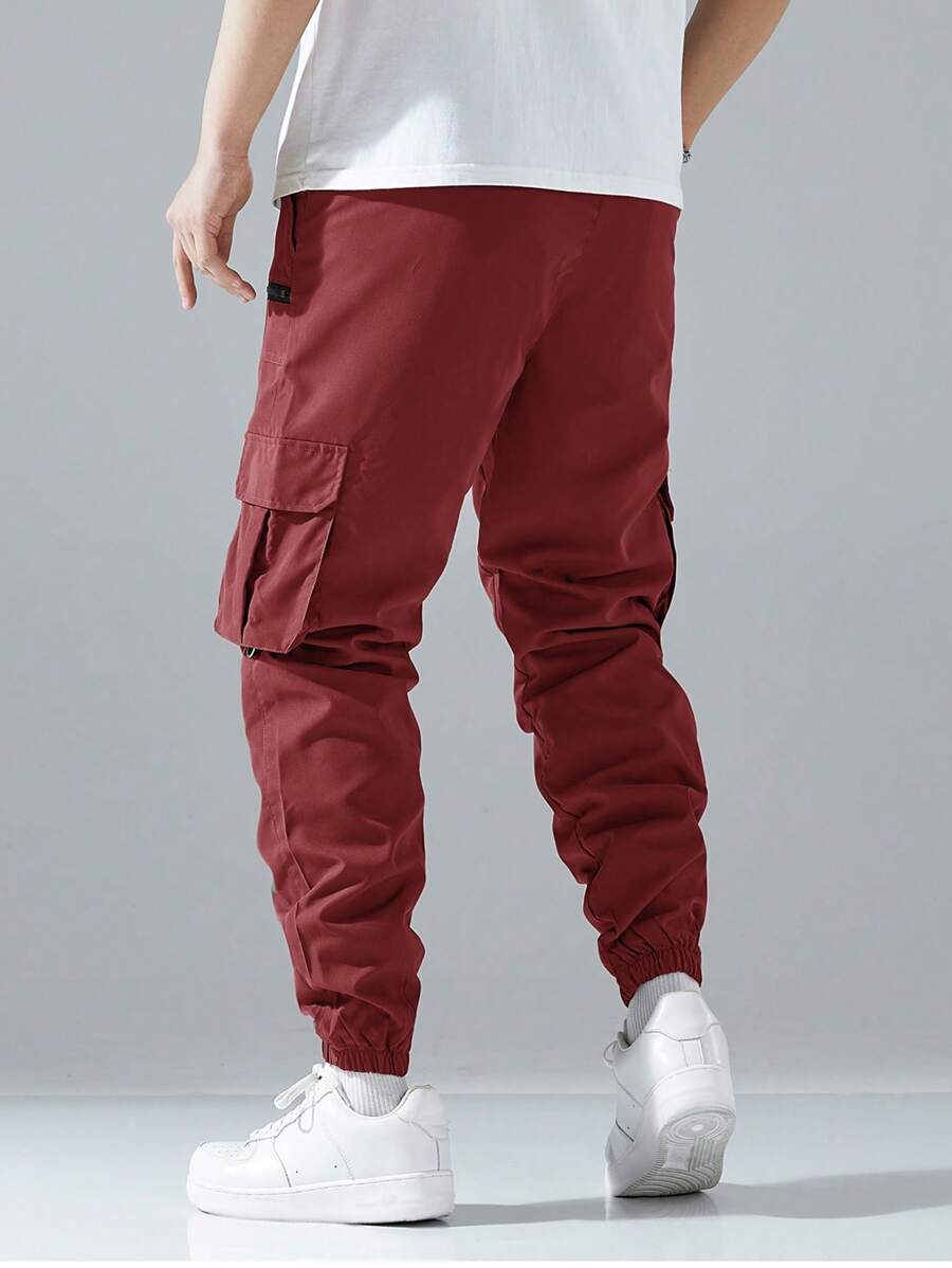 Pantalon cargo ample avec poches à rabat et cordons de serrage pour homme