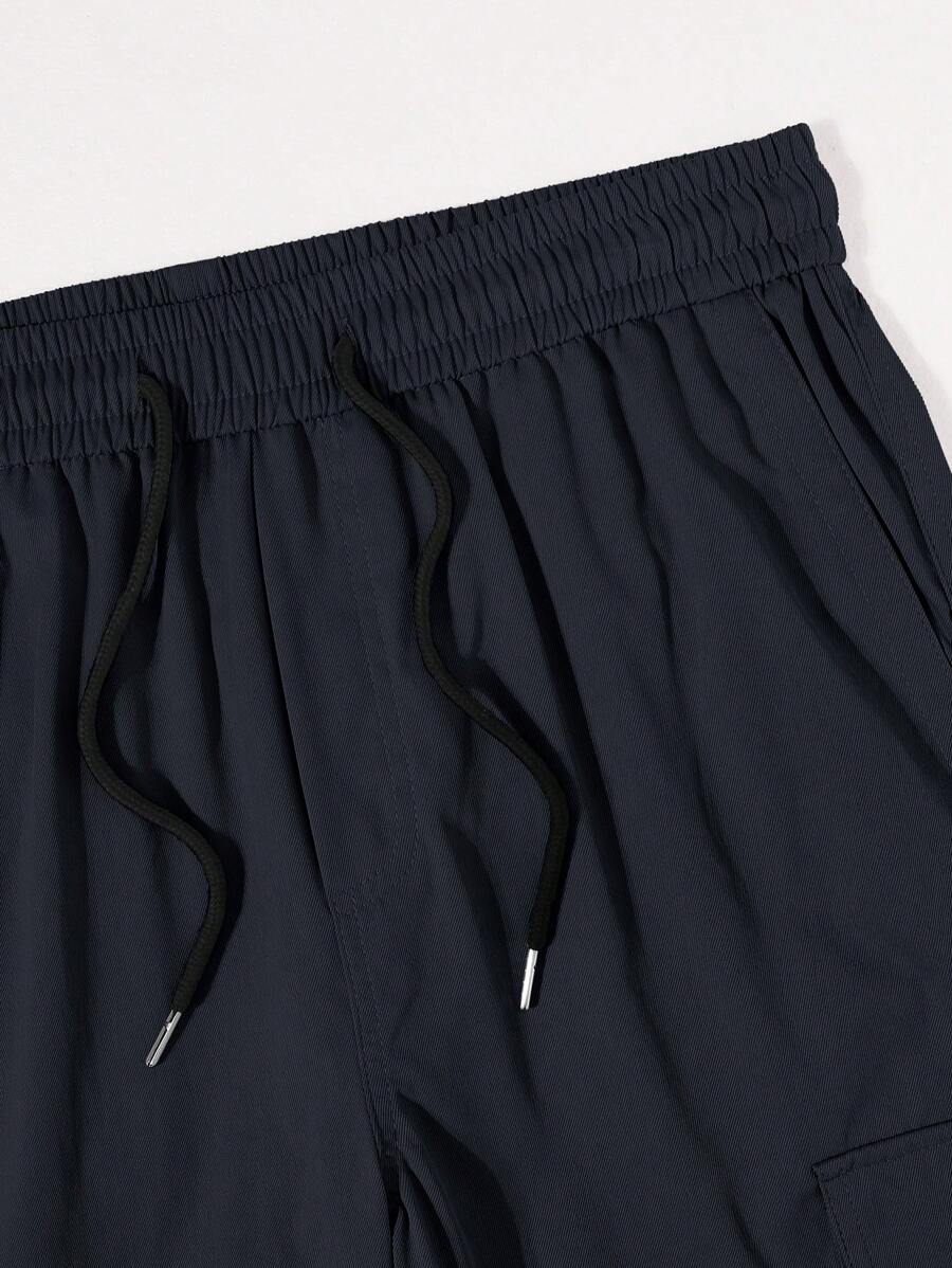 Pantalon cargo ample et décontracté avec cordon de serrage à la taille et poches à rabat