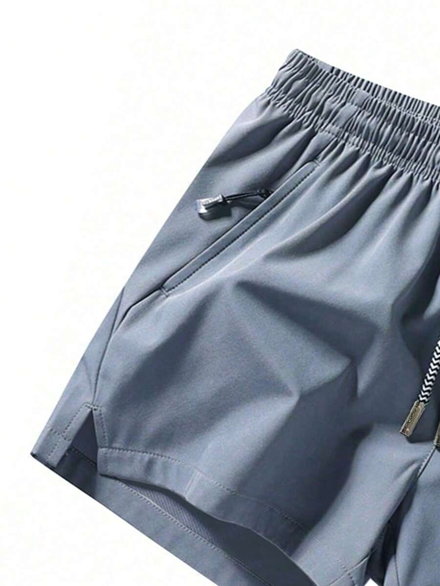 Shorts de sport taille élastique avec poches zippées et cordon
