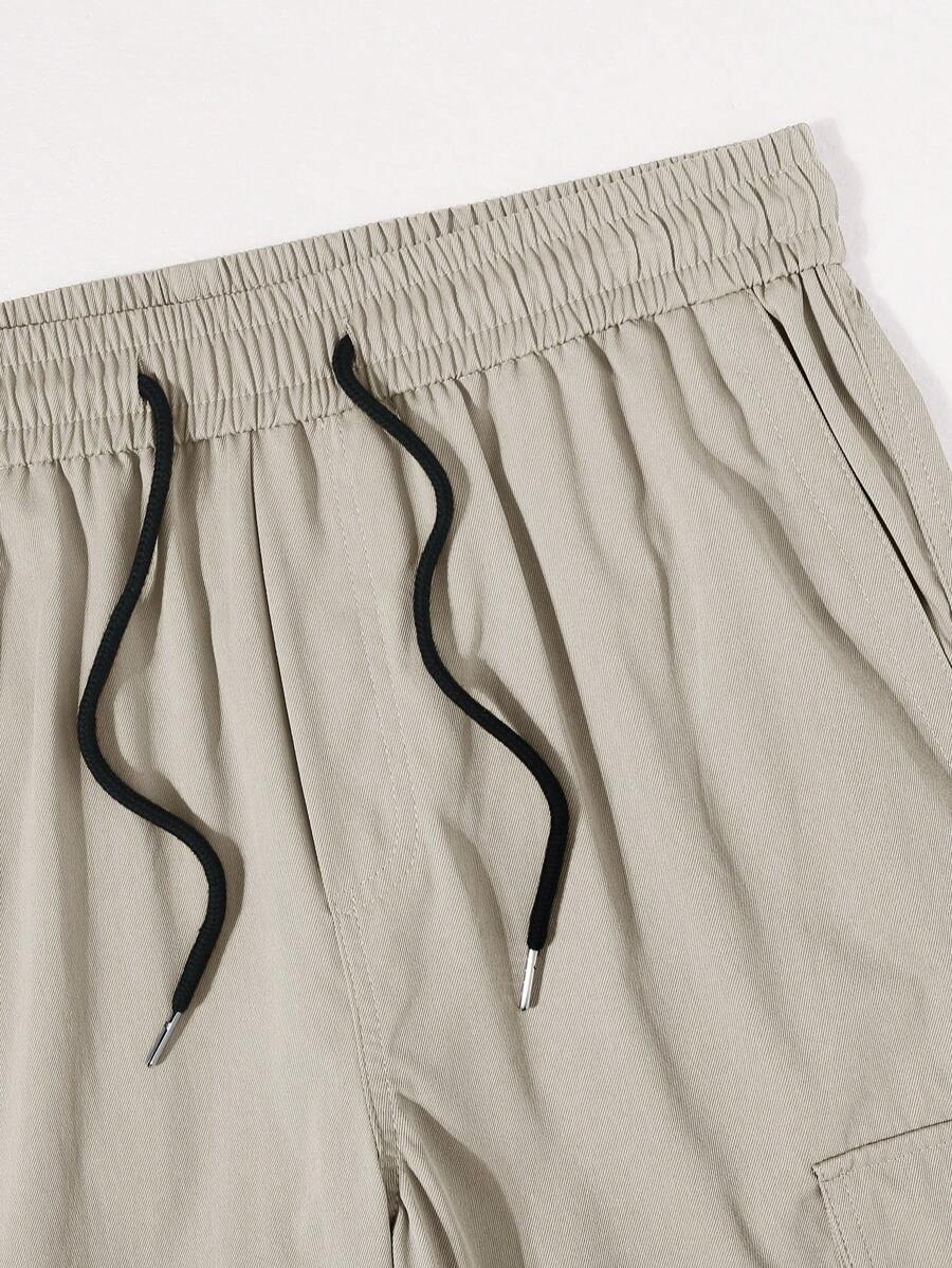 Pantalon cargo ample et décontracté avec cordon de serrage à la taille et poches à rabat
