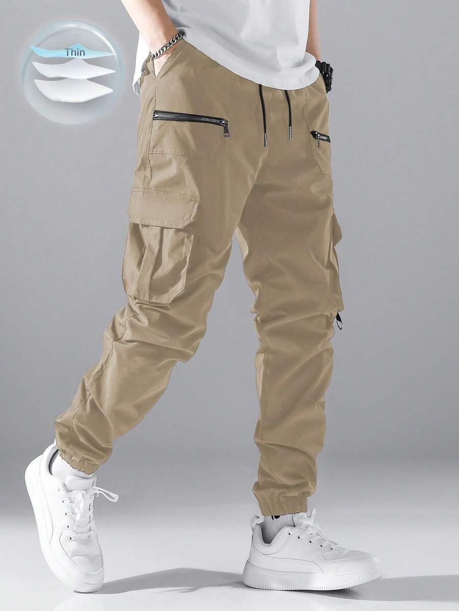 Pantalon cargo ample avec poches à rabat et cordons de serrage pour homme