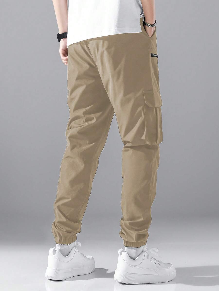 Pantalon cargo ample avec poches à rabat et cordons de serrage pour homme