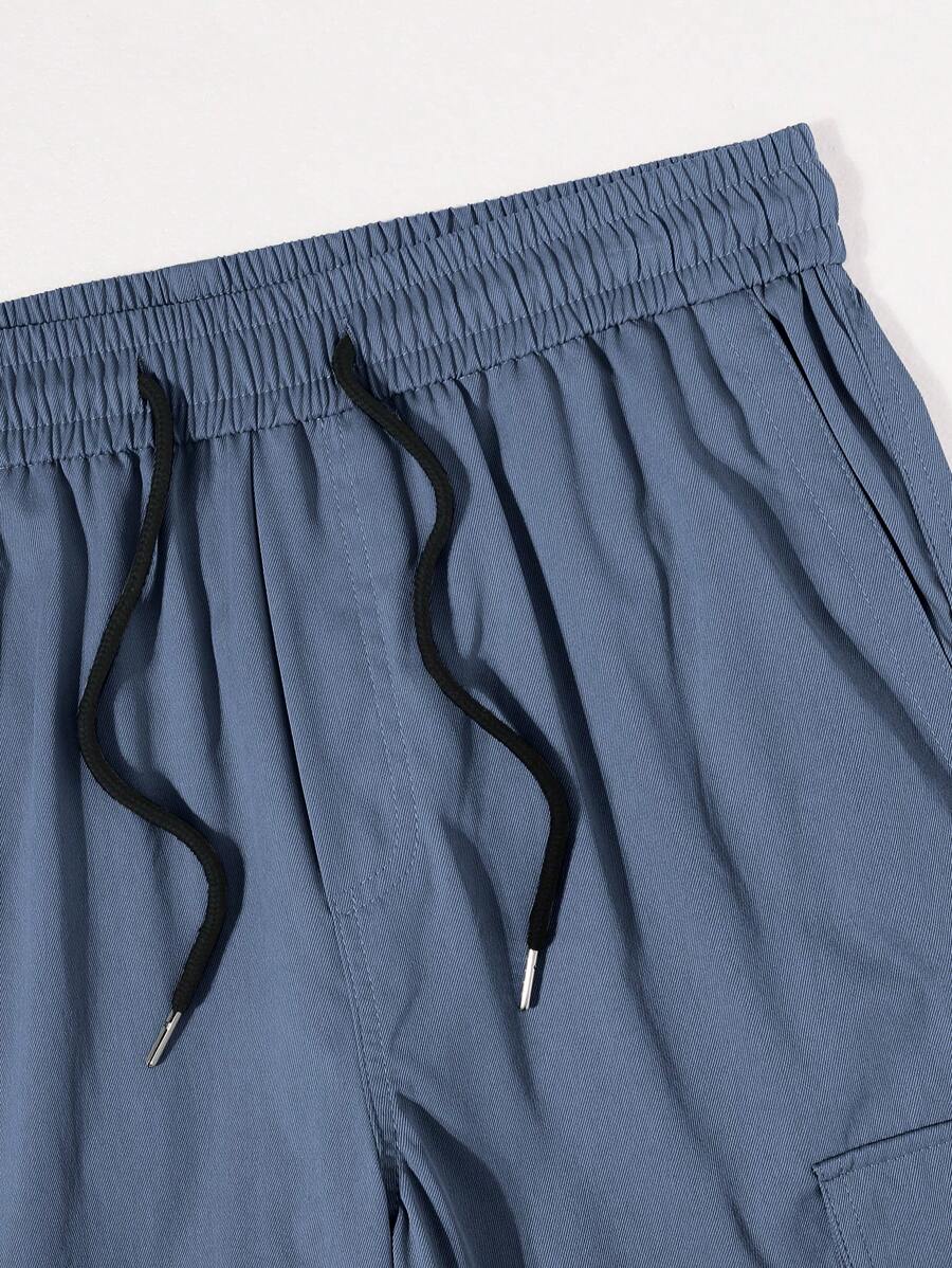 Pantalon cargo ample et décontracté avec cordon de serrage à la taille et poches à rabat