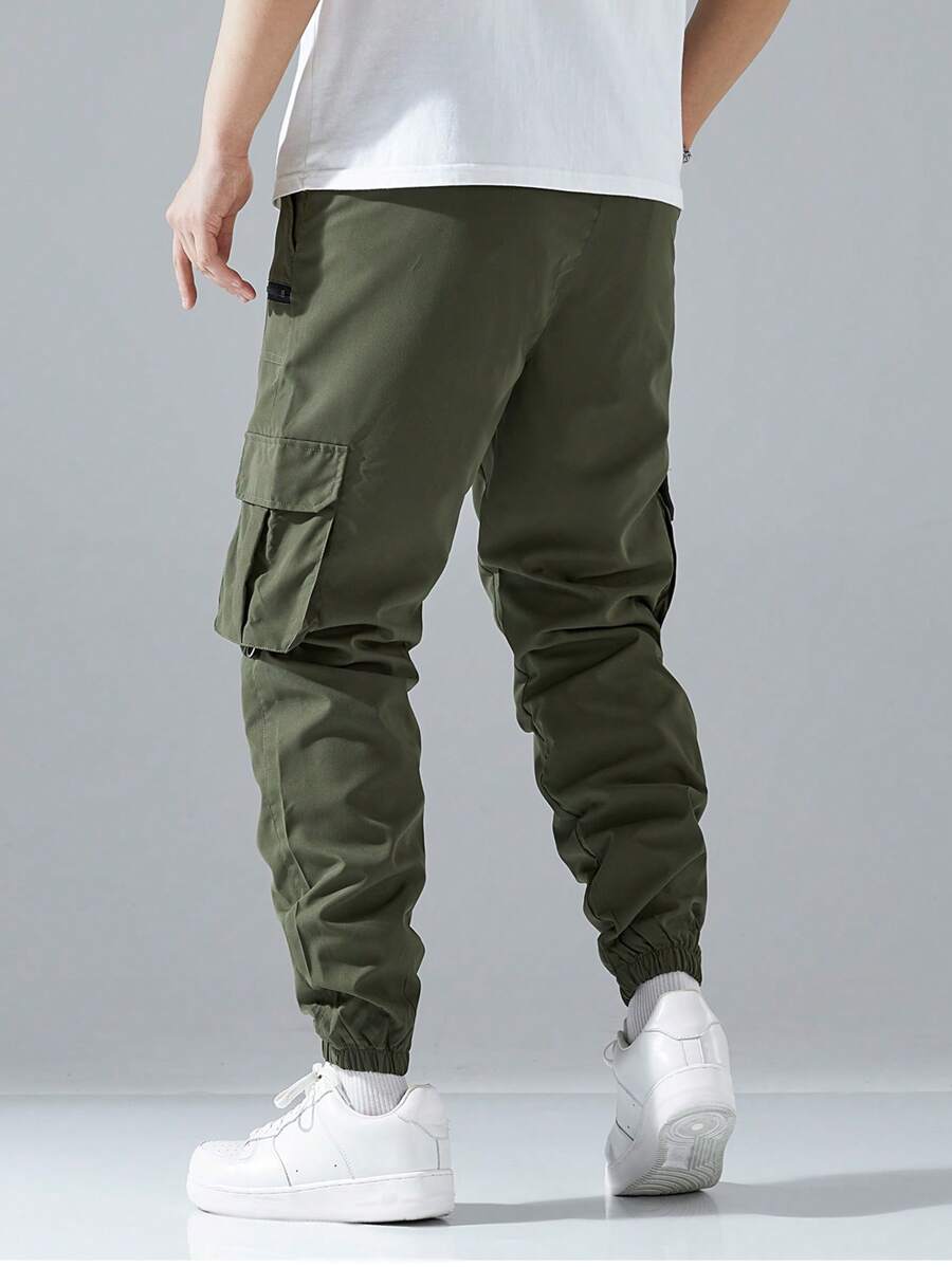 Pantalon cargo ample avec poches à rabat et cordons de serrage pour homme