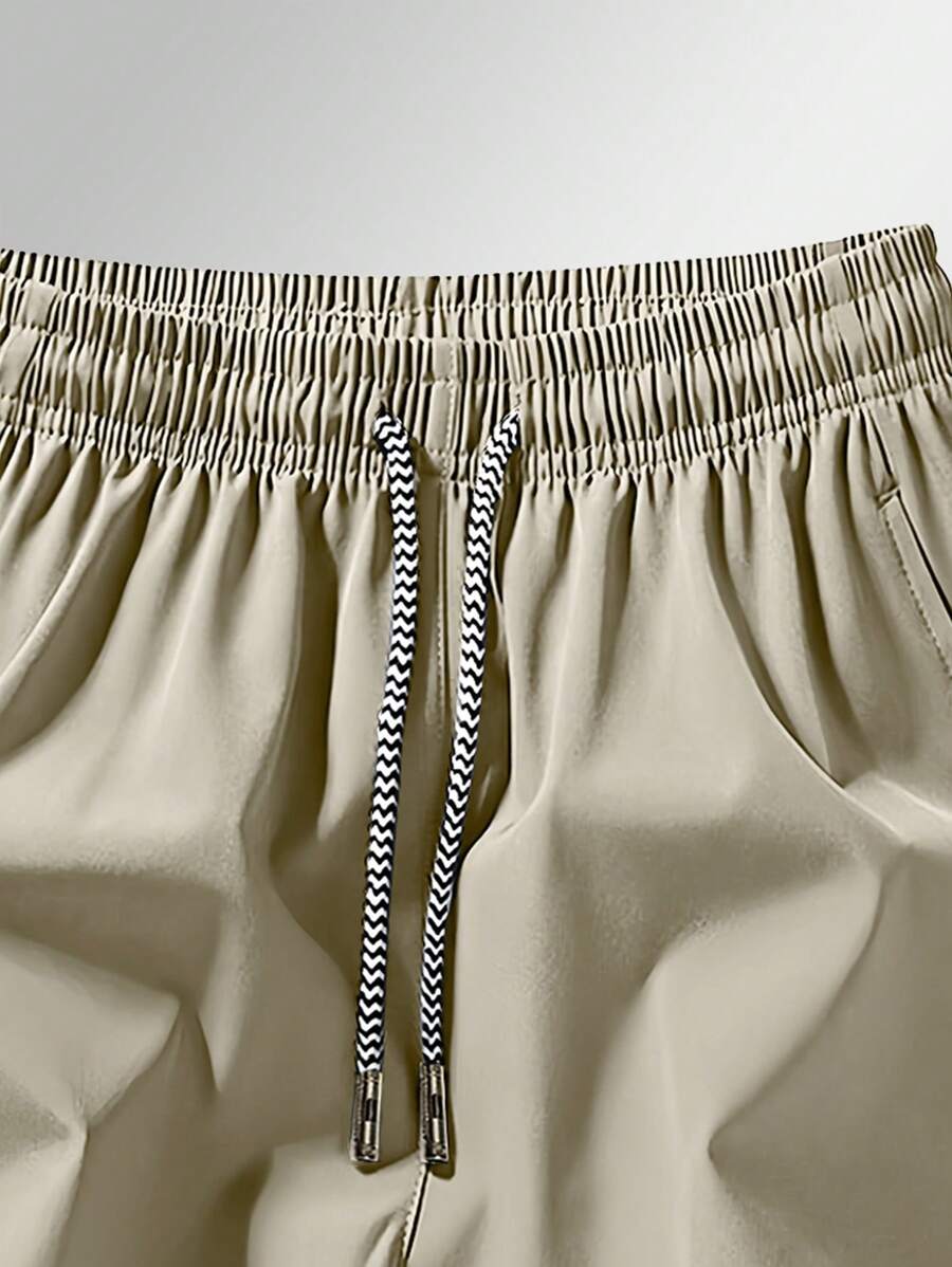 Shorts de sport taille élastique avec poches zippées et cordon