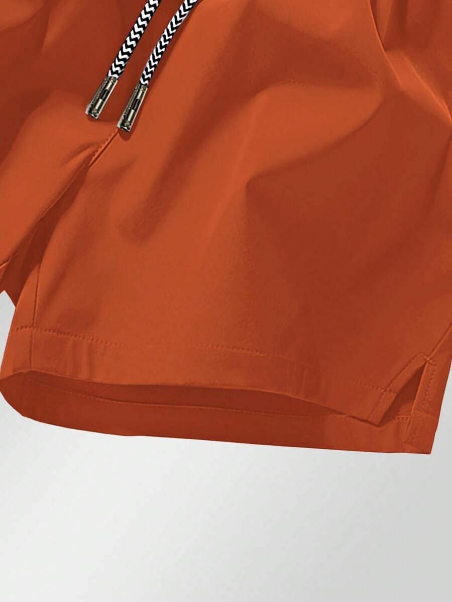 Shorts de sport taille élastique avec poches zippées et cordon
