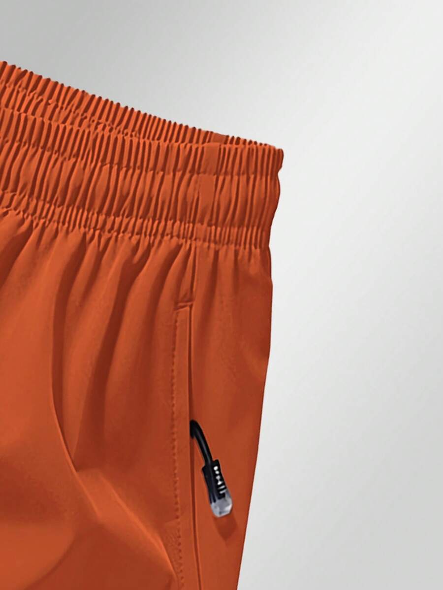 Shorts de sport taille élastique avec poches zippées et cordon