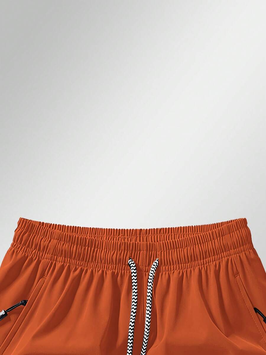 Shorts de sport taille élastique avec poches zippées et cordon