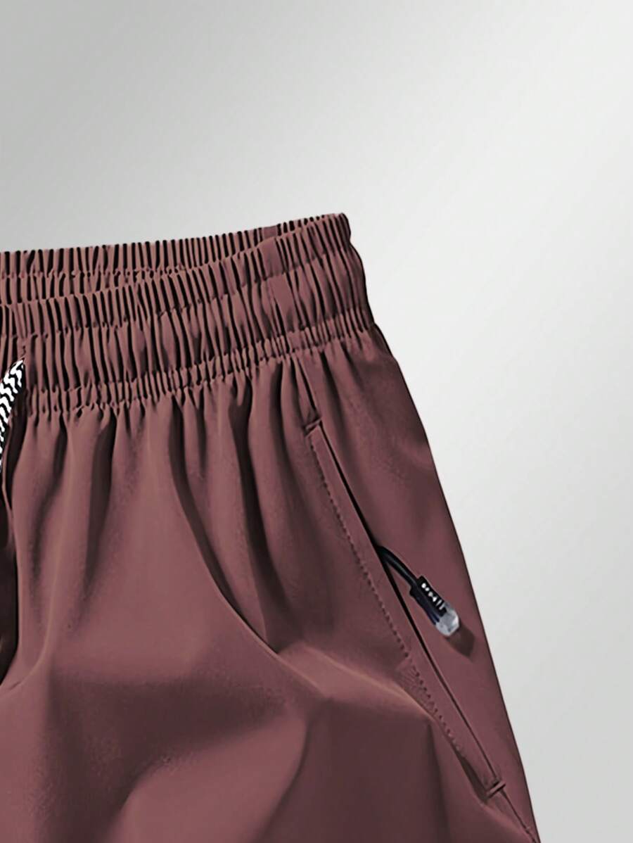 Shorts de sport taille élastique avec poches zippées et cordon