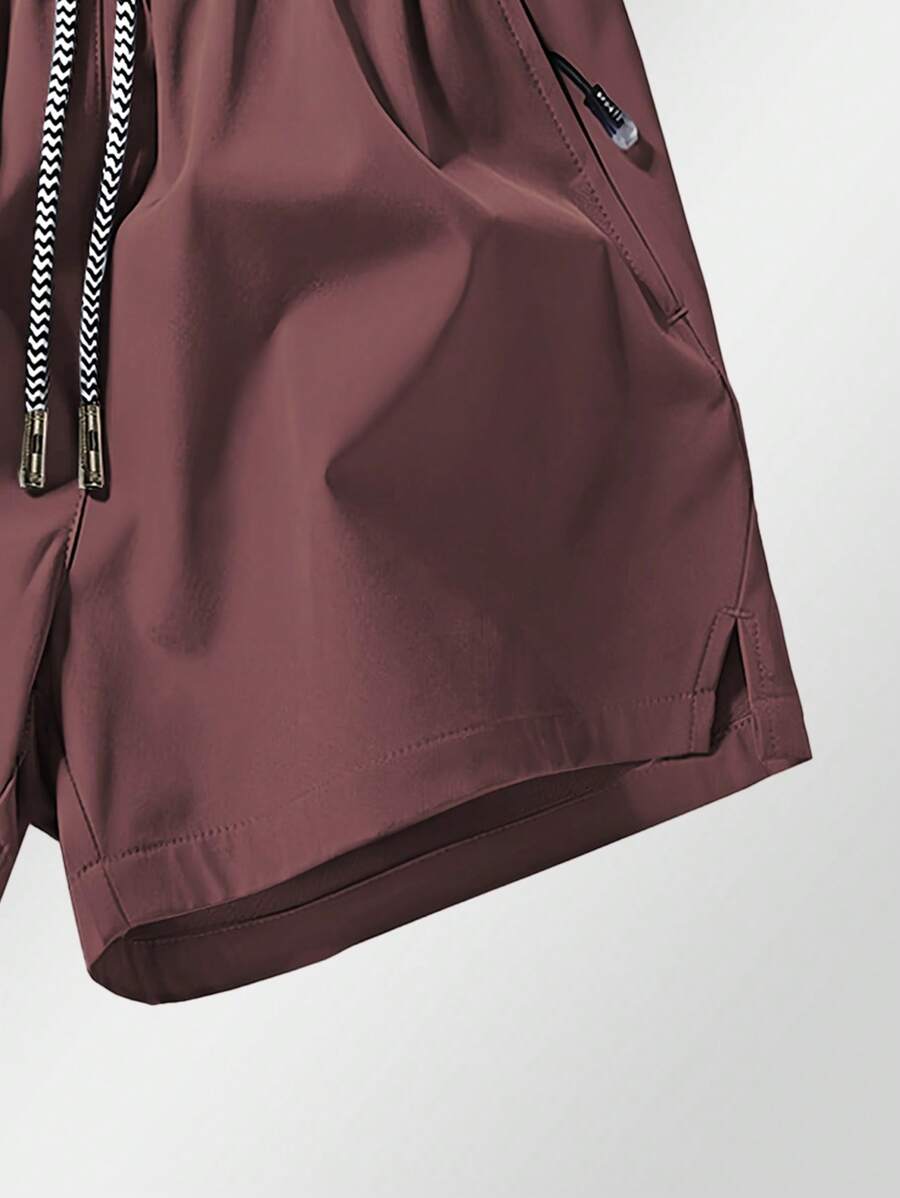 Shorts de sport taille élastique avec poches zippées et cordon