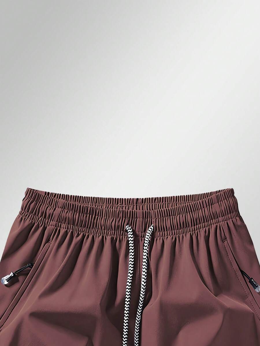 Shorts de sport taille élastique avec poches zippées et cordon