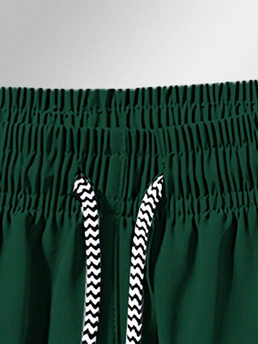 Shorts de sport taille élastique avec poches zippées et cordon
