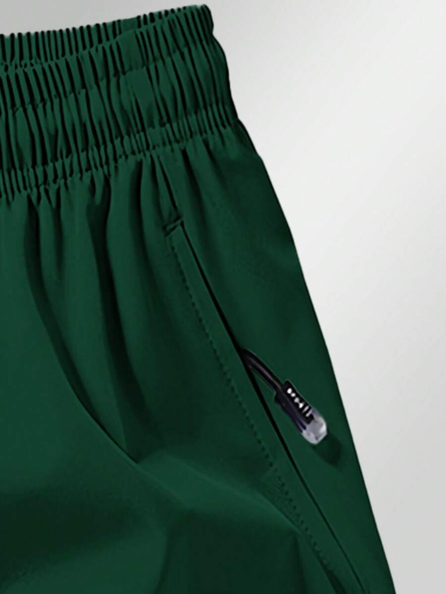 Shorts de sport taille élastique avec poches zippées et cordon