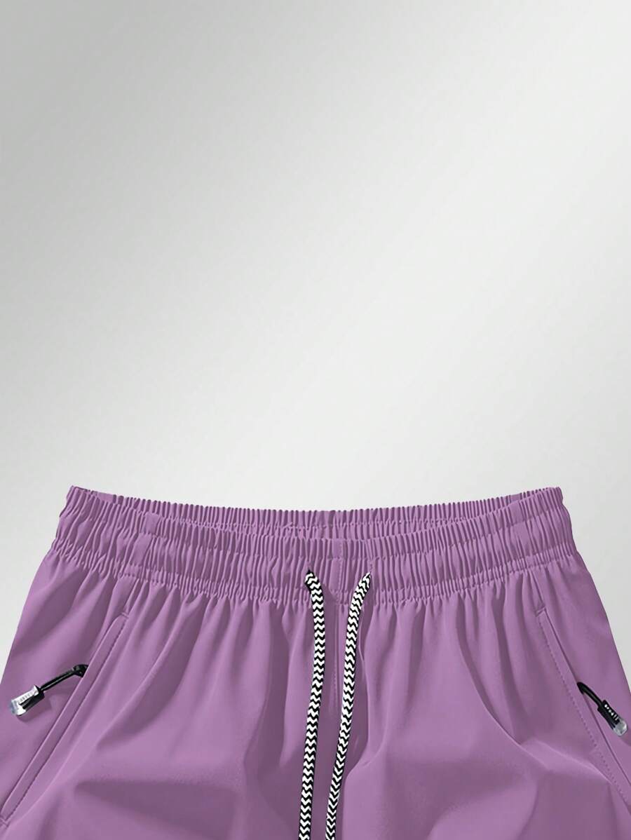 Shorts de sport taille élastique avec poches zippées et cordon