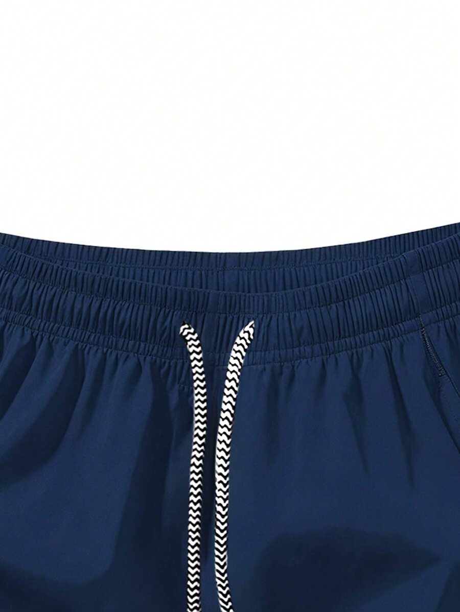 Shorts de sport taille élastique avec poches zippées et cordon