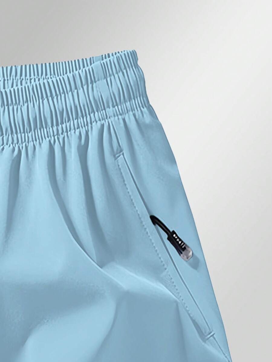 Shorts de sport taille élastique avec poches zippées et cordon